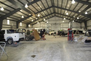 cars and trucks being worked on