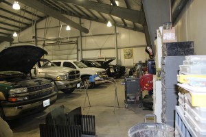 cars and trucks being worked on